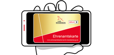 Eine Hand mit der Ehrenamtskarte